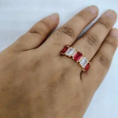 Picture of vibrant gold ring adorned with colorful gemstones