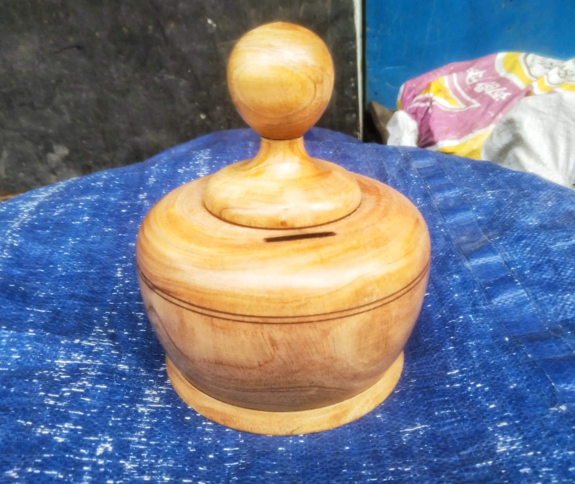 Picture of wooden money bank for saving money - Multicolor