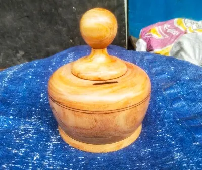 Picture of wooden money bank for saving money - Multicolor