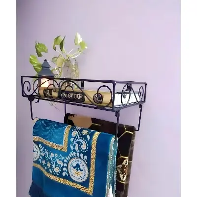 Picture of Quran Sharif and jaynamaz stand.