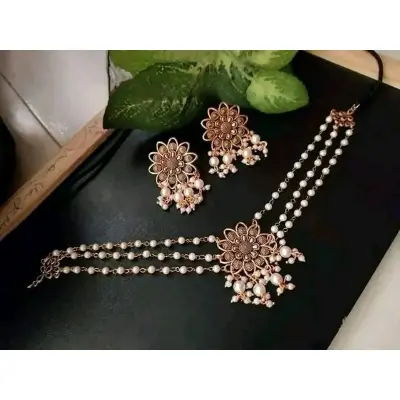 Picture of Gorgeous party wear antique golden necklace and earring set for girls and woman. - Gold