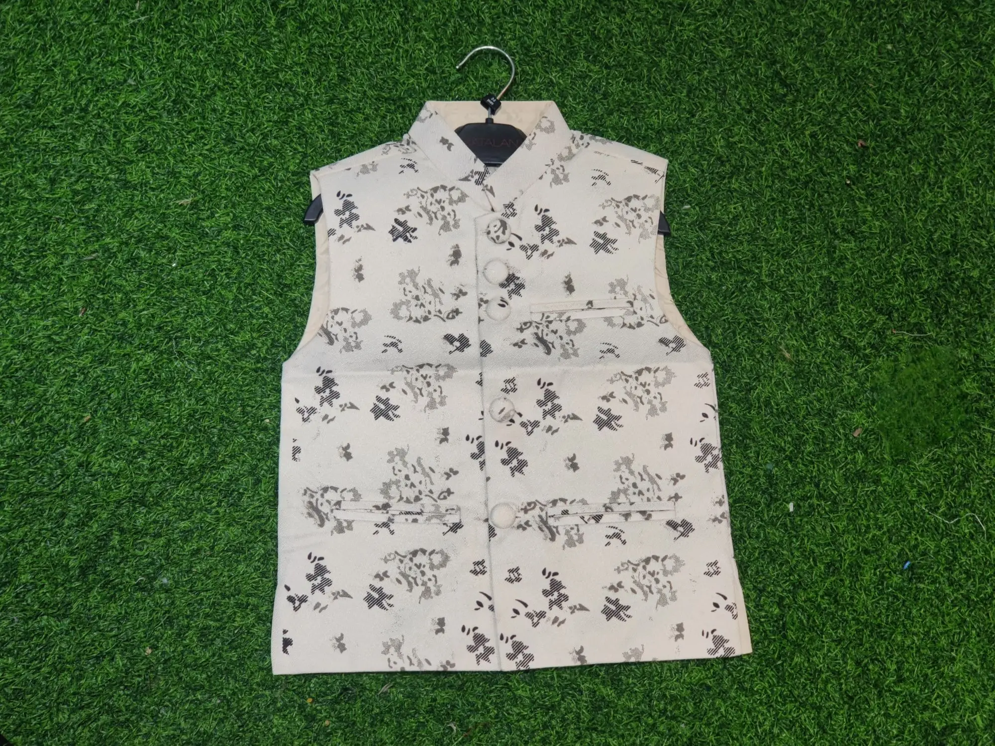 Picture of white ptinted waist coat for boys