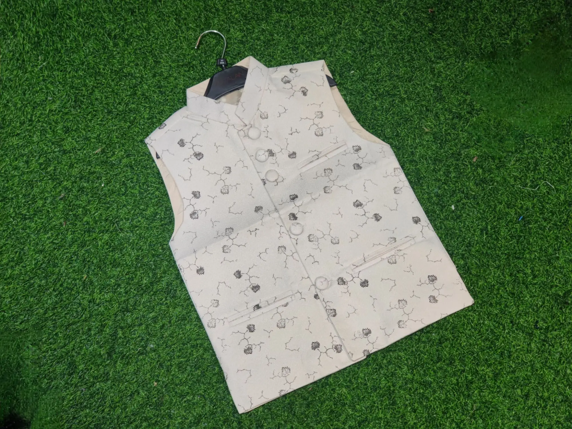 Picture of white ptinted waist coat for boys