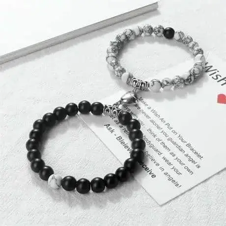 Picture of Magnetic Heart Bracelets for Couples (2 Piece) | Small Rubber Band Magnet Stone Bell Bracelet with Knotted Head Rope