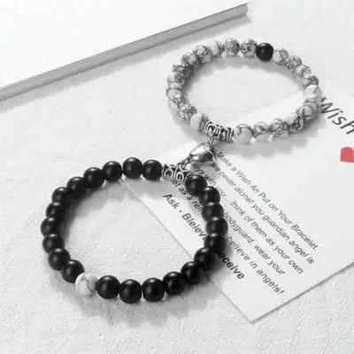 Picture of Magnetic Heart Bracelets for Couples (2 Piece) | Small Rubber Band Magnet Stone Bell Bracelet with Knotted Head Rope