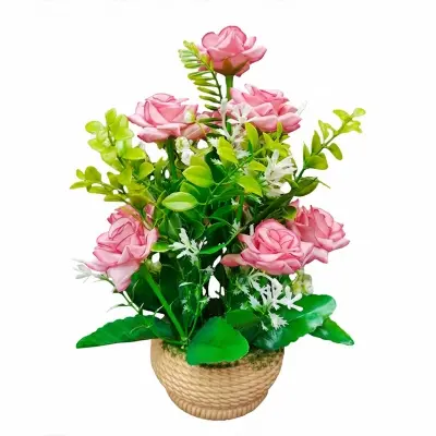 Picture of artificial flower arrangement featuring pink roses and greenery in a woven pot. 