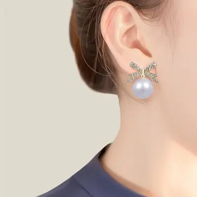 Picture of Luxury Rhinestone Bowknot Pearl Drop Earrings - Gold Plated