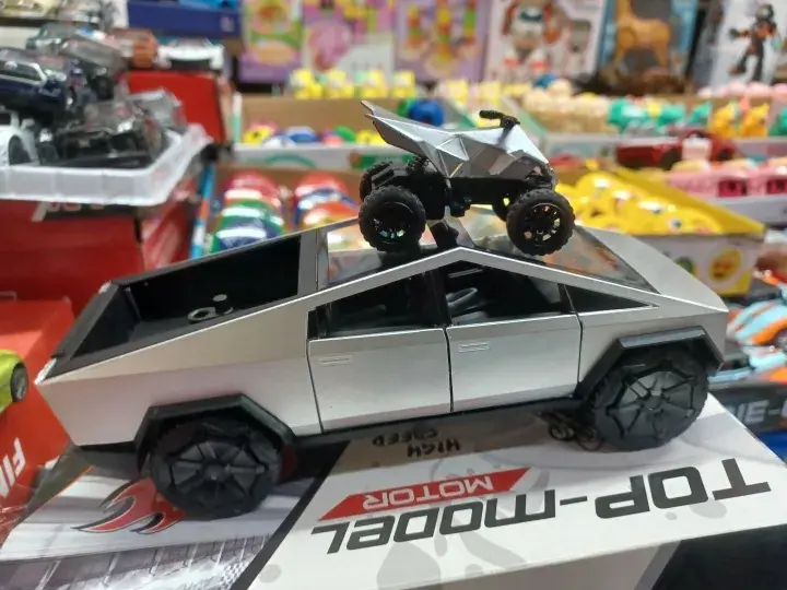 Picture of 1:28 Tesla Cybertruck Diecast Metal Alloy Model car Sound Light Pull Back Collection Kids Toy Gifts