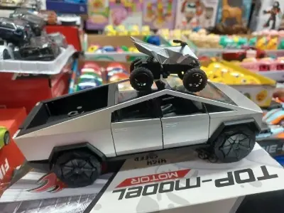 Picture of 1:28 Tesla Cybertruck Diecast Metal Alloy Model car Sound Light Pull Back Collection Kids Toy Gifts