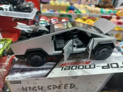 Picture of 1:28 Tesla Cybertruck Diecast Metal Alloy Model car Sound Light Pull Back Collection Kids Toy Gifts(Black)