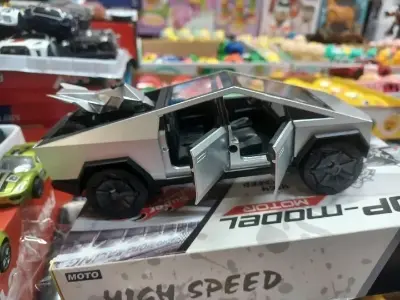 Picture of 1:28 Tesla Cybertruck Diecast Metal Alloy Model car Sound Light Pull Back Collection Kids Toy Gifts(Black)