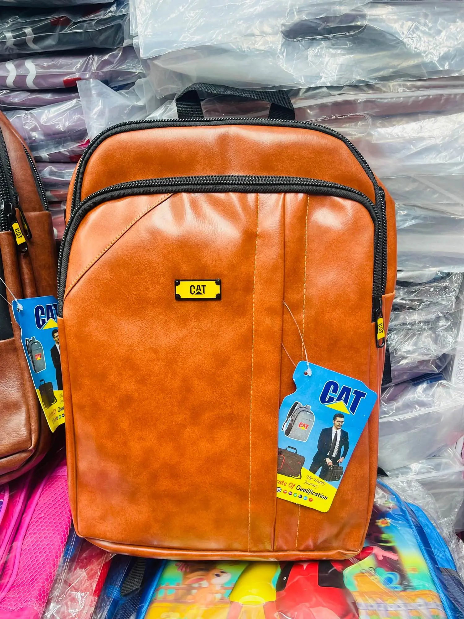 Picture of 🔥 Trendy CAT Backpack for Men - Stylish Checkered Design Laptop Bag | Durable PU Leather Office/College/University Bag | Chocolate Brown Color Backpack