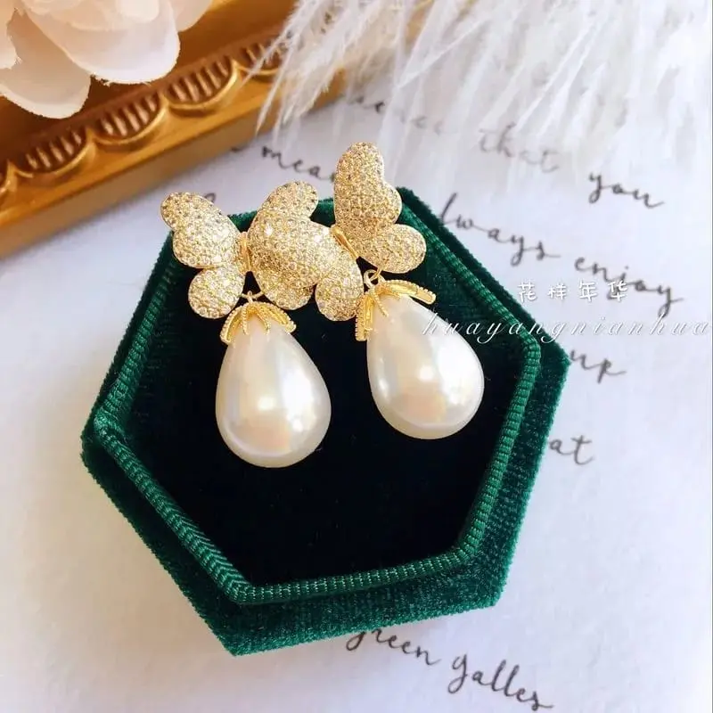 Picture of Korean version of fashion hot selling earrings simple temperament crystal butterfly pearl ear nail Earrings women