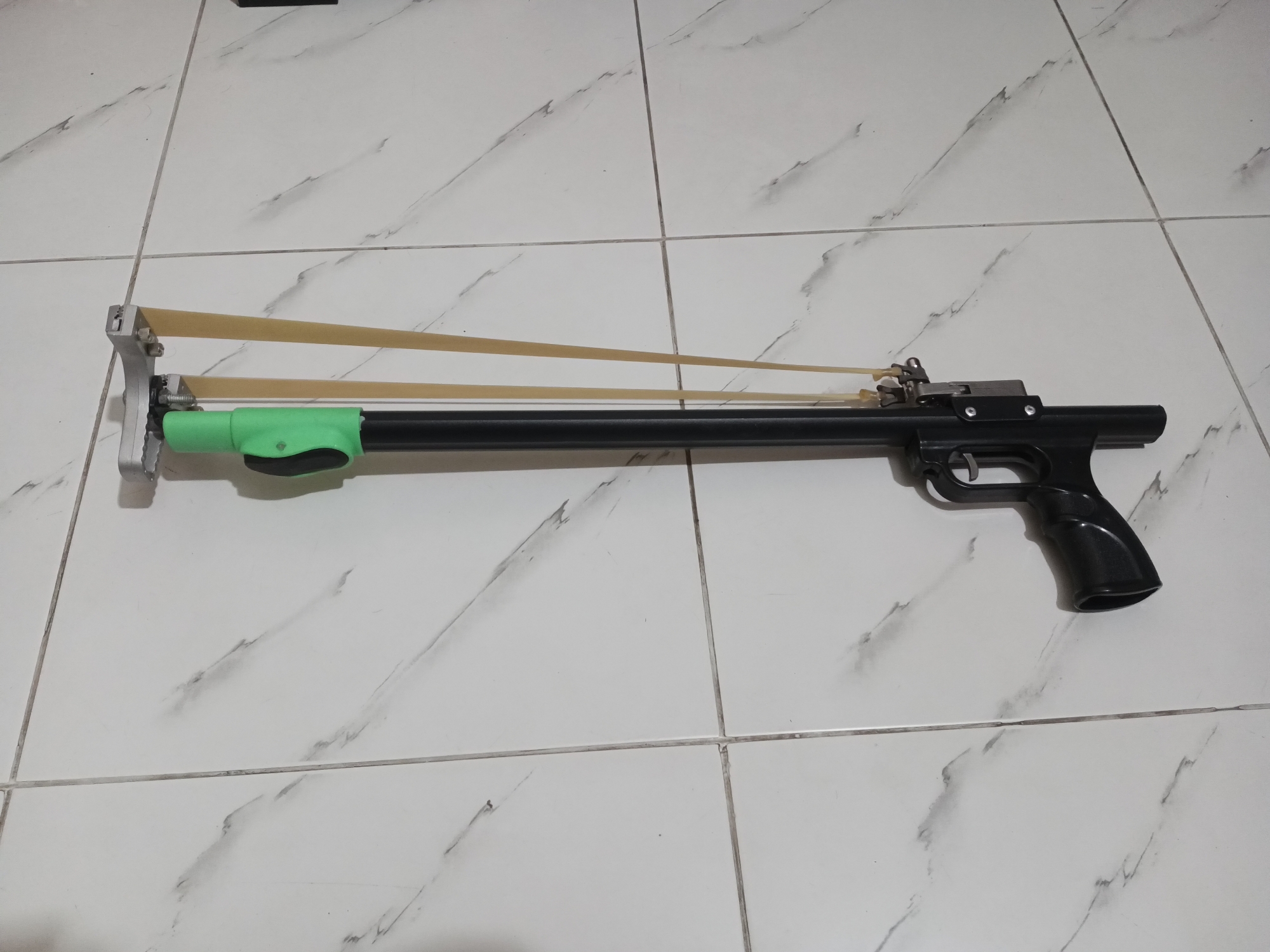 Picture of High quality Slingshott Rifle catapult for target practice Owl model telescopic 2 section folding with alloy head, resin handle grip and zinc alloy spreader sport archery (simple, carriable and smart model) (Black and Green)