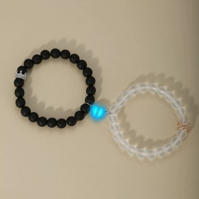 Picture of Shop Pro Magnetic Heart Bracelets for Couples (2 Piece) | Small Rubber Band Magnet Stone Bell Bracelet with Knotted Head Rope